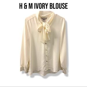 Ivory blouse, chic with golden hardware